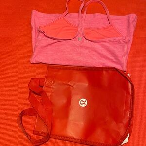 Lululemon pink tank top size 6 paired with a red tote bag Stylish and versatile.